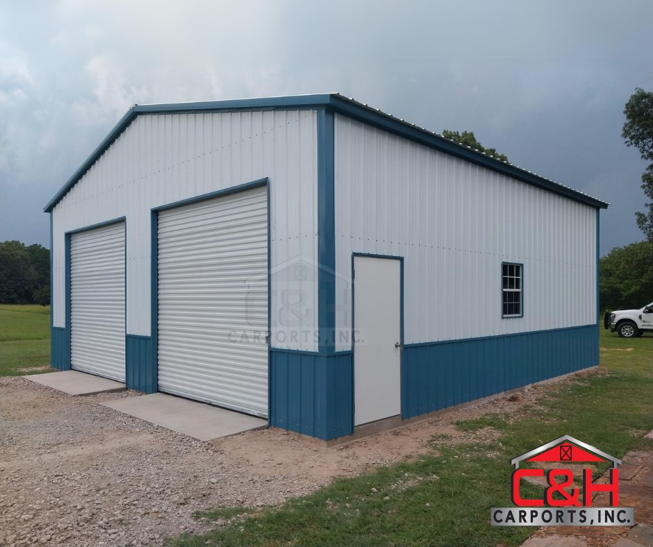 Enclosed metal garage with roll-up doors