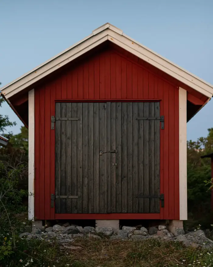 Red Graceland portable building with double barn doors